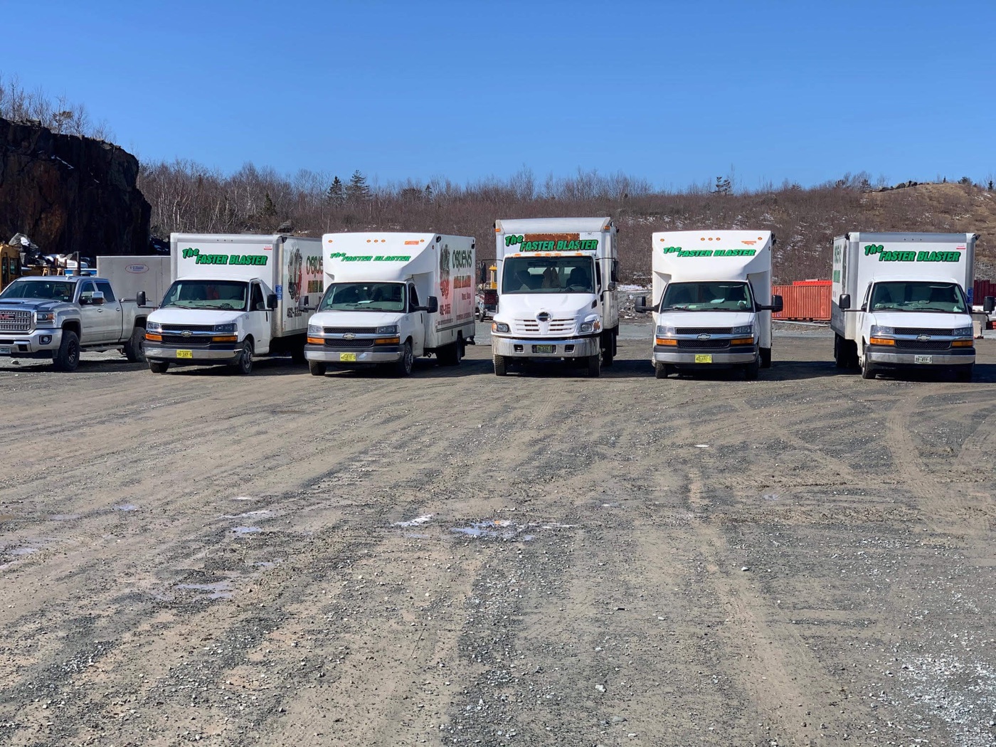 The O'Brien's Faster Blaster fleet of mobile wash trucks lined up at a Nova Scotia yard