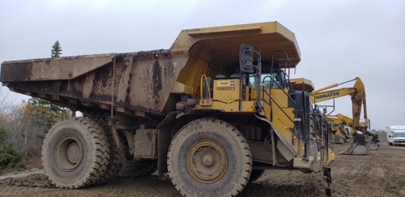 CAT haul truck before washing, heavy dirt build up