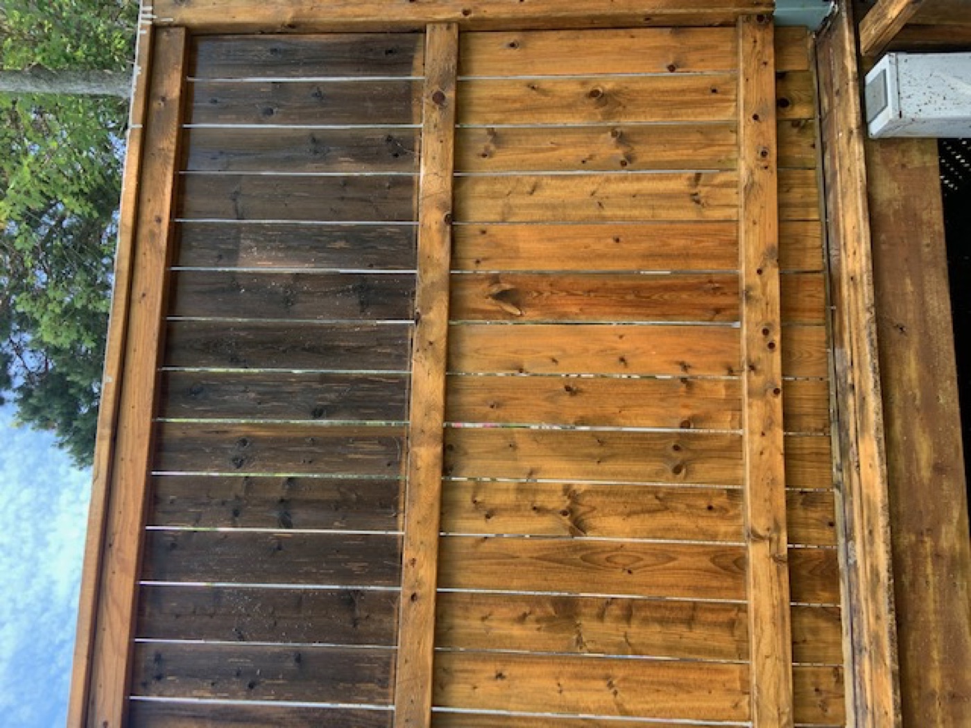 A wooden fence washed back to its original colour